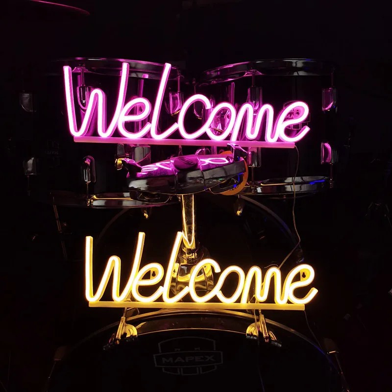 welcome neon led sign on the wall