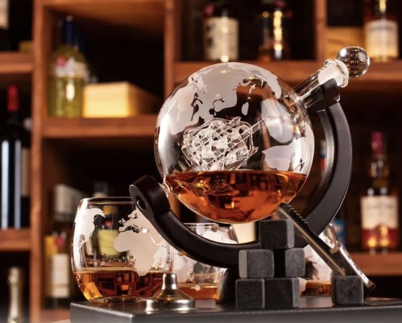 luxury whiskey set in the shape of a globe with ship