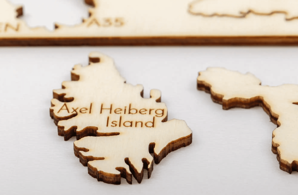 kit of exotic small wooden islands for a wooden map on the wall